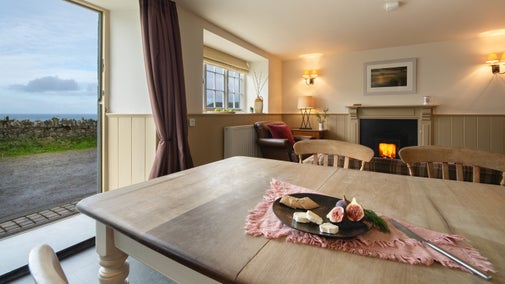 The dining table in the kitchen, at Doyden Stable Cottage, Cornwall